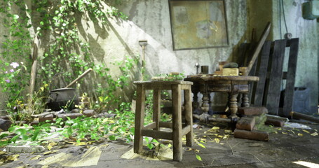 A small wooden stool sits beside a round table in a neglected interior filled with greenery. Sunlight filters in through the window, illuminating scattered debris and plants.