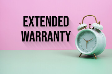 Black alarm clock on a pastel green and pink background with the text 