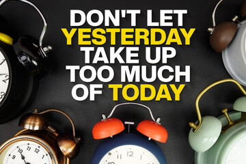 Don't Let Yesterday Take Up Too Much of Today text with alarm clock on black background