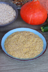 Assortment of various healthy fruits, vegetables, grains and legumes. Selective focus, wooden background.