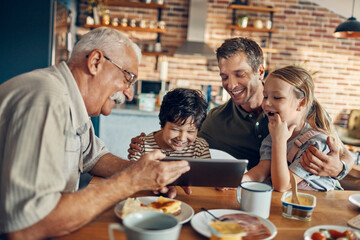 Multigenerational family enjoying breakfast at home