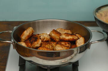 Golden Brown Cutlets Cooking in Frying Pan on Stove
