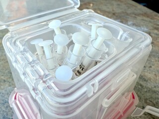 Syringes in medical sharps container