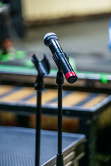 Stage microphone on stand ready for performance.