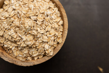 oat flakes in a wooden bowl