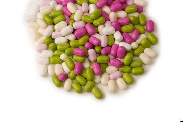 Sweet multicolored candies isolated on white background.