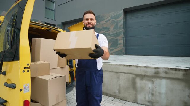 Delivery man unloading cardboard boxes from van