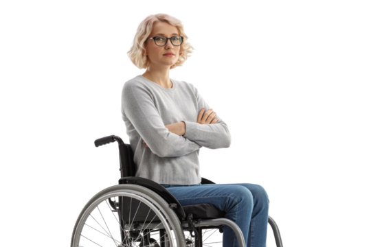 A serious blonde woman with glasses sits in a wheelchair, arms crossed, looking directly at the viewer with a neutral expression. background removed