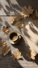 Cozy autumn coffee break with leaves and open book