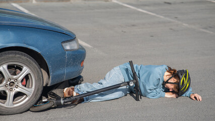 A Caucasian woman on a scooter after being hit by a car.