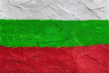 Bulgarian national flag painted on textured concrete wall surface in white, green and red colors. Concept of Bulgaria, patriotism and cultural identity, national symbol