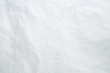 Soft white fabric with subtle texture and gentle light creating depth feel