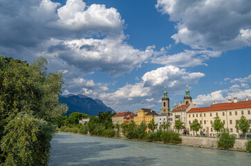 Buildings with colorful facades on the banks of the Inn River in Innsbruck, Austria