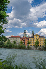 Buildings with colorful facades on the banks of the Inn River in Innsbruck, Austria