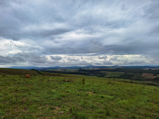 clouds over the meadow and mountains