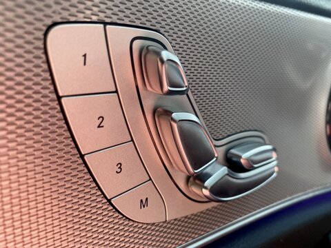 Close up of a luxury car seat adjustment control panel inside a vehicle interior - Powered by Adobe