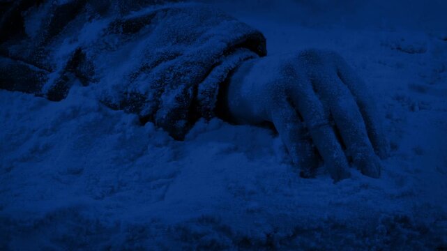 Unconscious Or Dead Person On The Snow At Night