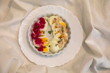 Hearty and rustic food, boiled egg with horseradish and decorated with sprigs of fresh thyme.