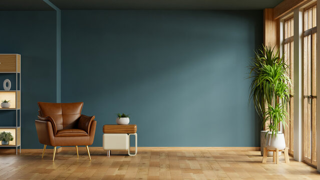 A chic and contemporary living room interior with an empty dark blue wall mockup, a comfortable brown leather armchair, a stylish side table- 3D rendering