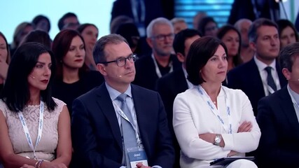 Diverse Business Professionals Attending Conference Session in Formal Attire Focused on Presentation - Powered by Adobe