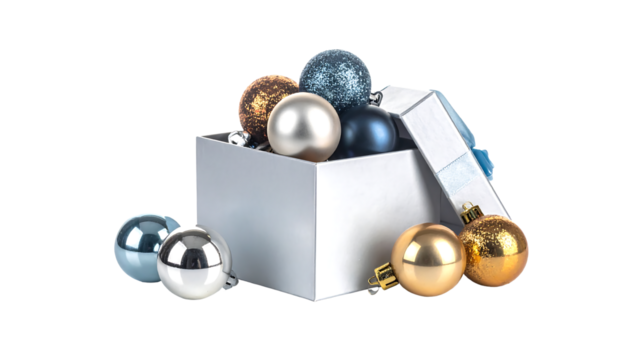 Silver box filled with gold, blue, and silver christmas ornaments on a white background, cutout