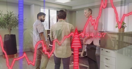 Discussing data, three professionals in business attire analyzing red line graph overlay in office
