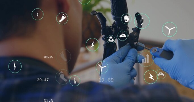 Mechanic wearing blue gloves tightening brake cable on handlebar at workshop bench, with IoT icons