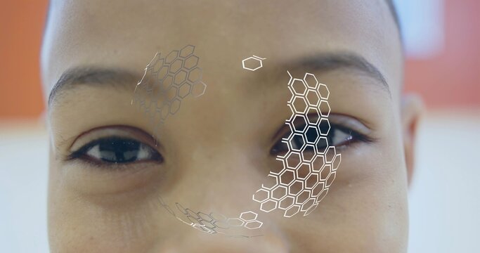 Showing close-up boy face in bright softly lit room, with hexagonal AR overlay graphics - Powered by Adobe