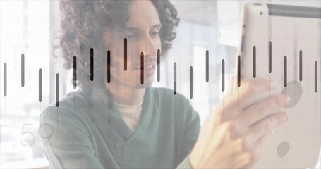 Reviewing male professional wearing green sweater holding tablet in office, with equalizer overlay