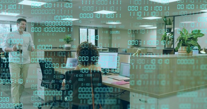 Walking worker with coffee mug passing female coder at dual monitors in office, with binary overlay