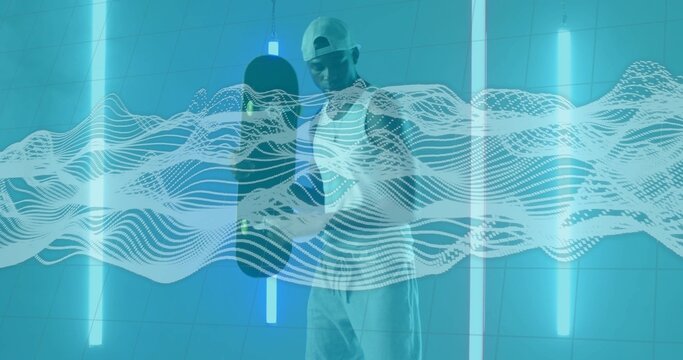 Man wearing cap holding skateboard vertically in futuristic studio, with neon tubes, wave overlay