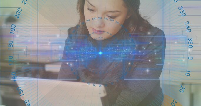 Leaning Asian woman in dark knit sweater analyzing tablet data at office, with digital overlay