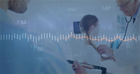 Doctor using stethoscope checking child on exam table, with assistant writing on clipboard
