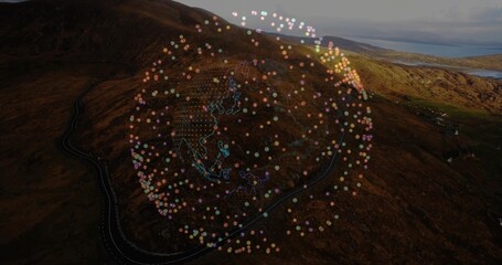 Hovering data globe floating above hillside and distant water, with winding road and neon outlines