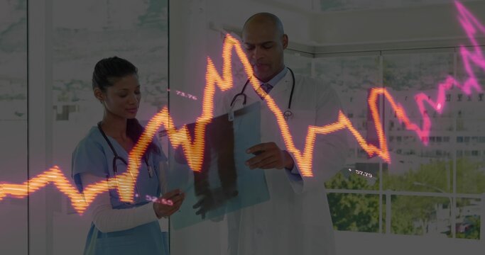 Doctor and nurse wearing attire reviewing radiograph and smartphone in exam room, with ECG graph - Powered by Adobe