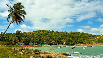 Idyllic tropical paradise showcasing lush greenery, tranquil turquoise waters, and vibrant umbrellas dotting the shore. A serene coastal escape.