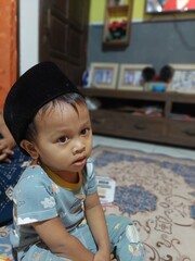 Expression of a 2 year old boy who is happy