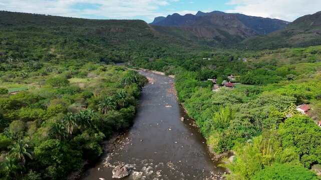 Drone view of tropical river ecosystem, Dense vegetation and natural beauty, Sumapaz River captured in Tolemaida Colombia. High quality 4k footage