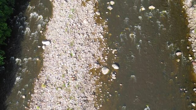 Flowing river through tropical valley, Aerial drone shot of natural Colombian landscape, Sumapaz River seen from Tolemaida region. High quality 4k footage