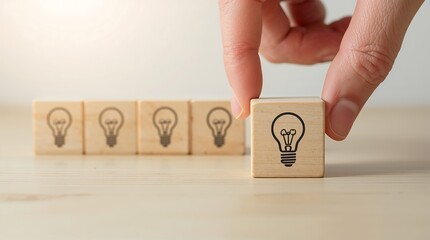 Wooden block with a light bulb icon, idea creative business inspiration with lamp bulb symbol. Creativity, Brainstorm, Genius team , Leadership icon ,symbol innovative different smart.