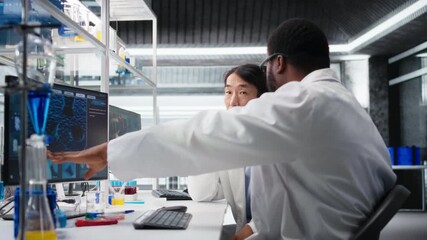 Multiracial engineers using scientific gear in research facility used for complex experiments. Diverse team of scientists in high tech laboratory doing genetics research using lab equipment, camera A - Powered by Adobe