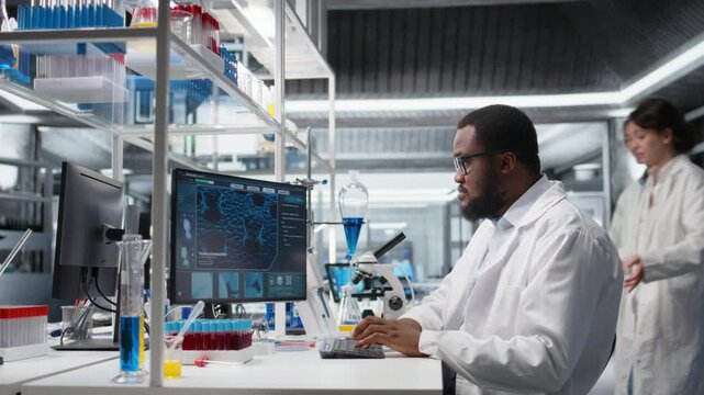 Laboratory scientist squinting eyes at computer monitor, processing DNA patient data, thinking. Lab specialist looking at genetic analysis diagnostics, brainstorming scientific breakthroughs, camera A