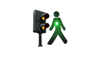 Pedestrian signal lit man next to warm-toned street light