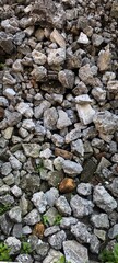 Heap of grey broken concrete and stones