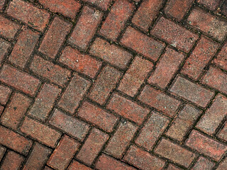 Detailed red brick paving with beautiful texture, perfect for adding a rustic, vintage charm to designs or backgrounds for websites and marketing materials