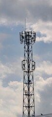Tall radio mast against overcast sky