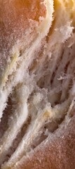 Torn bread detail showing soft airy textured interior