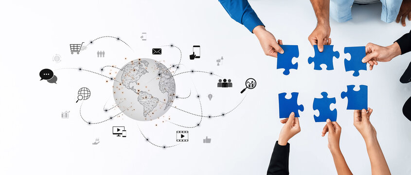 A creative concept showcasing hands holding puzzle pieces symbolizing teamwork, connected through digital elements representing global collaboration and communication. Trope