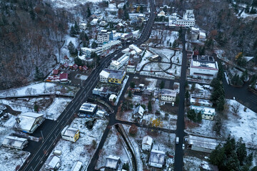 Aerial view of Nukabira Onsen village with the first snow in late October, Hokkaido, Japan –...