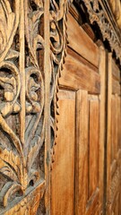 Javanese Gebyok carving detail. Gebyok is a typical Javanese furniture in the form of Javanese partitions which are generally made of teak wood. Can also be used for the door of the house